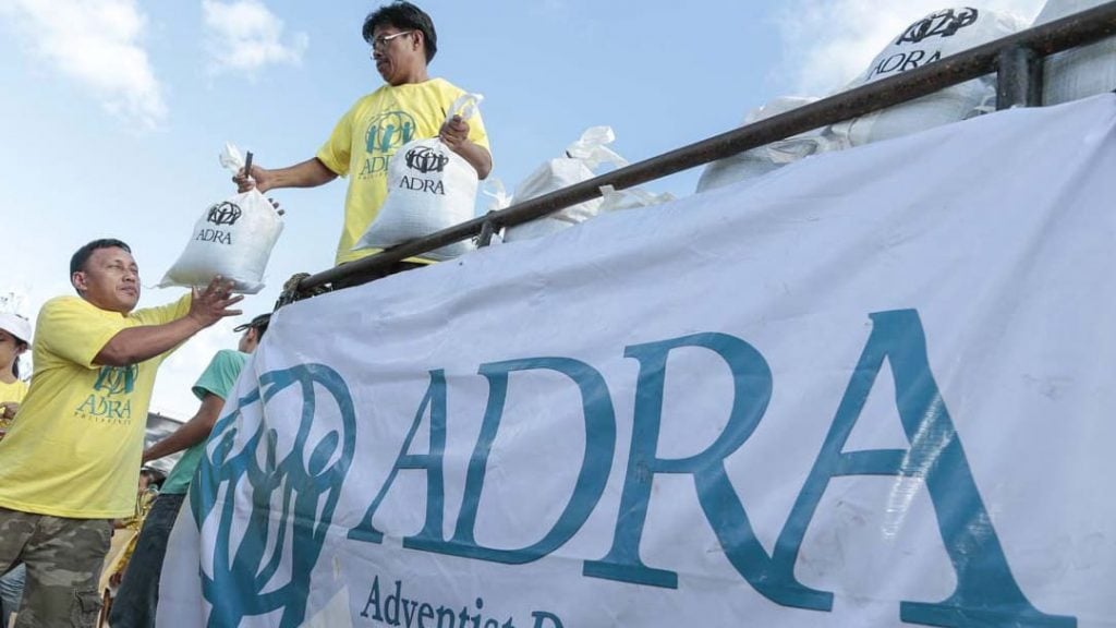 ADRA Philippines distributes emergency food packs after Typhoon Haiyan.