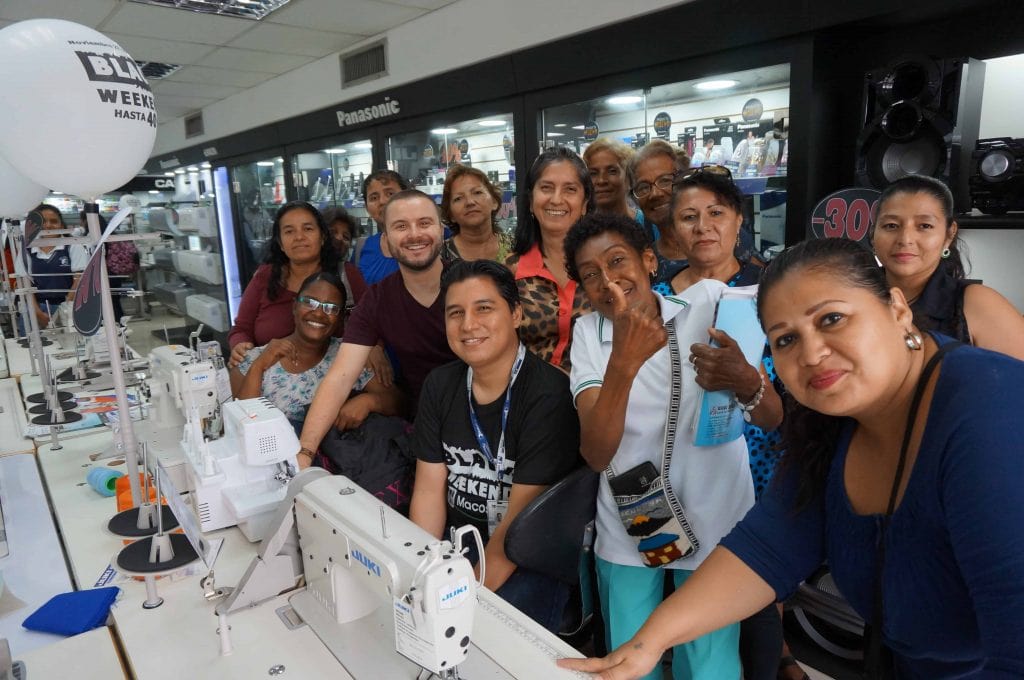 Ecuador. Jonathan visits sewing machine shop with women entrepreneurs