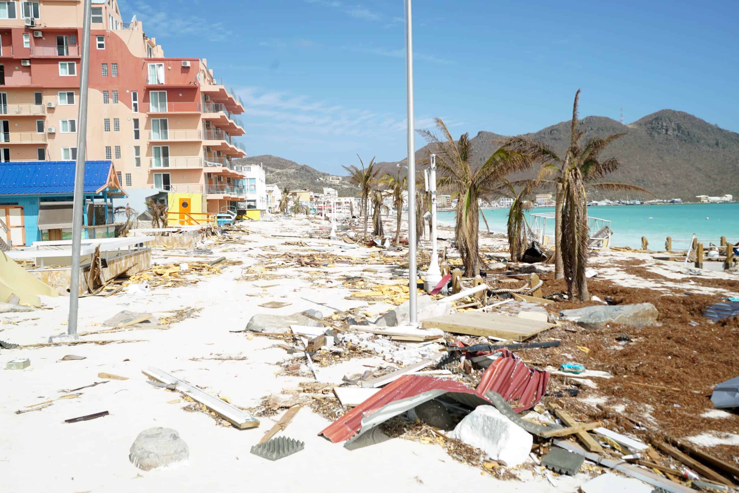 Philipsburg Sint maarten: Board walk and buildings completely covered with beach sand and debris after island got hit by hurricane Irma.