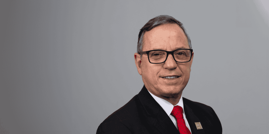 ADRA International logo and Paulo Lopes in a professional portrait.