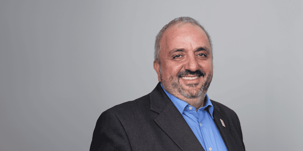 ADRA International representative smiling in a professional portrait.