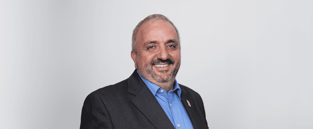 ADRA International representative smiling in professional attire.