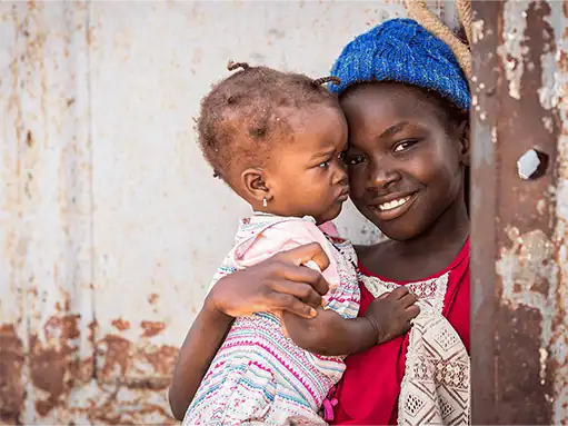 Helping hand from ADRA International supporting children and families in need worldwide.