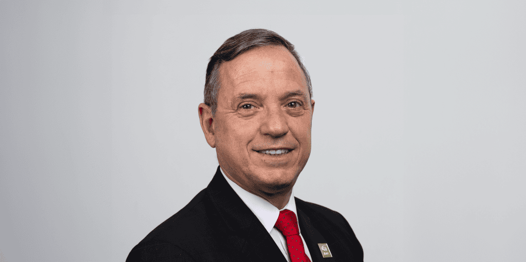 ADRA International representative speaking at a conference.