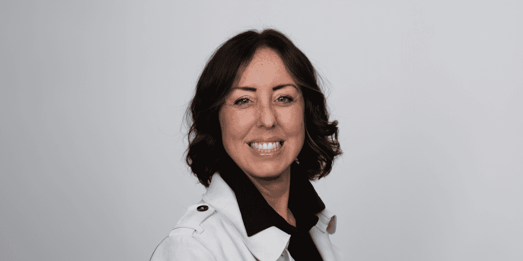 ADRA International representative smiling in professional attire.