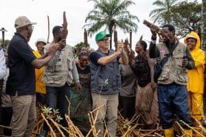 ADRA International team planting trees in a community for environmental sustainability.