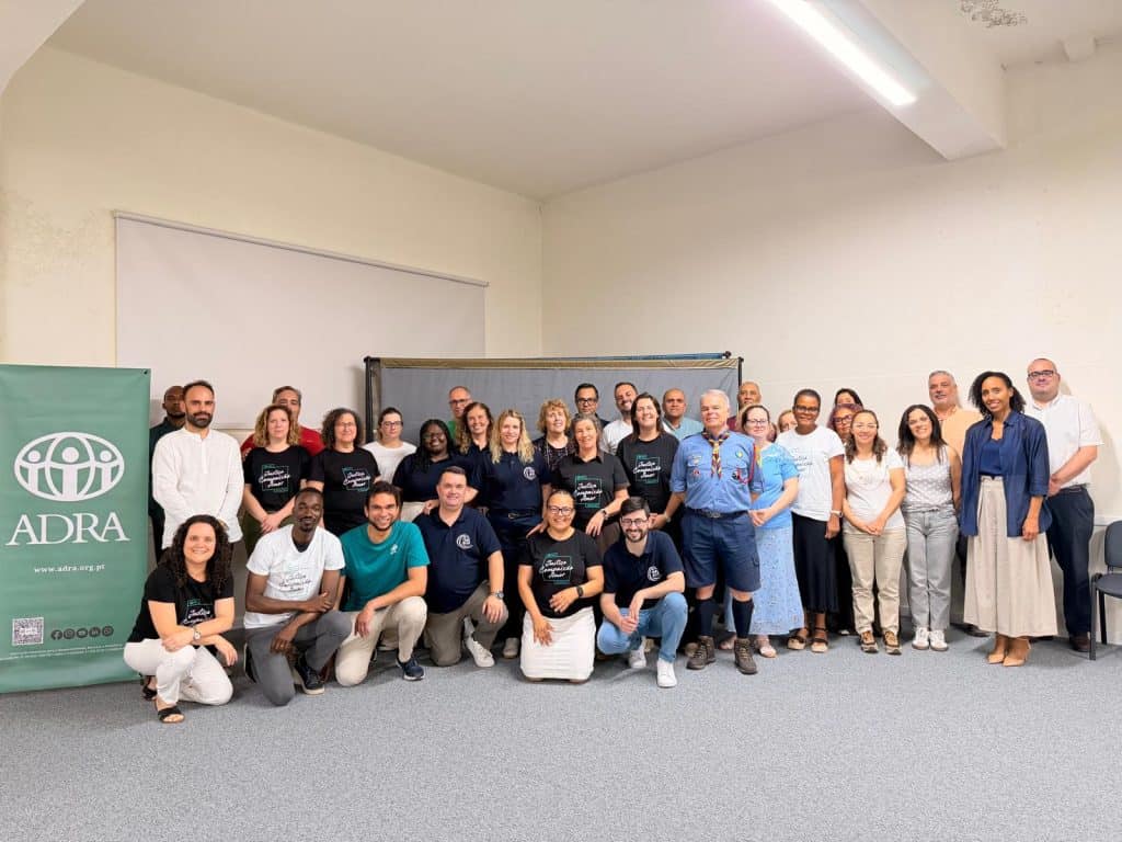 ADRA International team group photo at a conference or meeting.