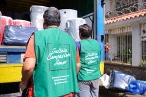 ADRA volunteers load supplies after Venezuela earthquake, showing compassion and aid.